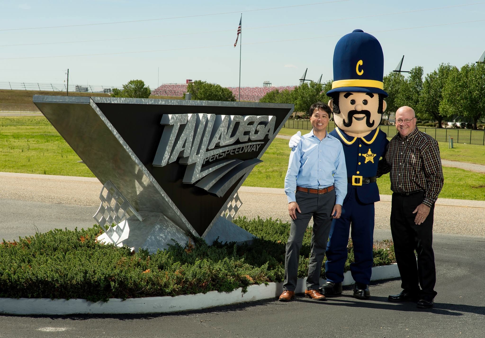 Jonathan Moral with the Cook's mascot at the Talladega Superspeedway entrance
