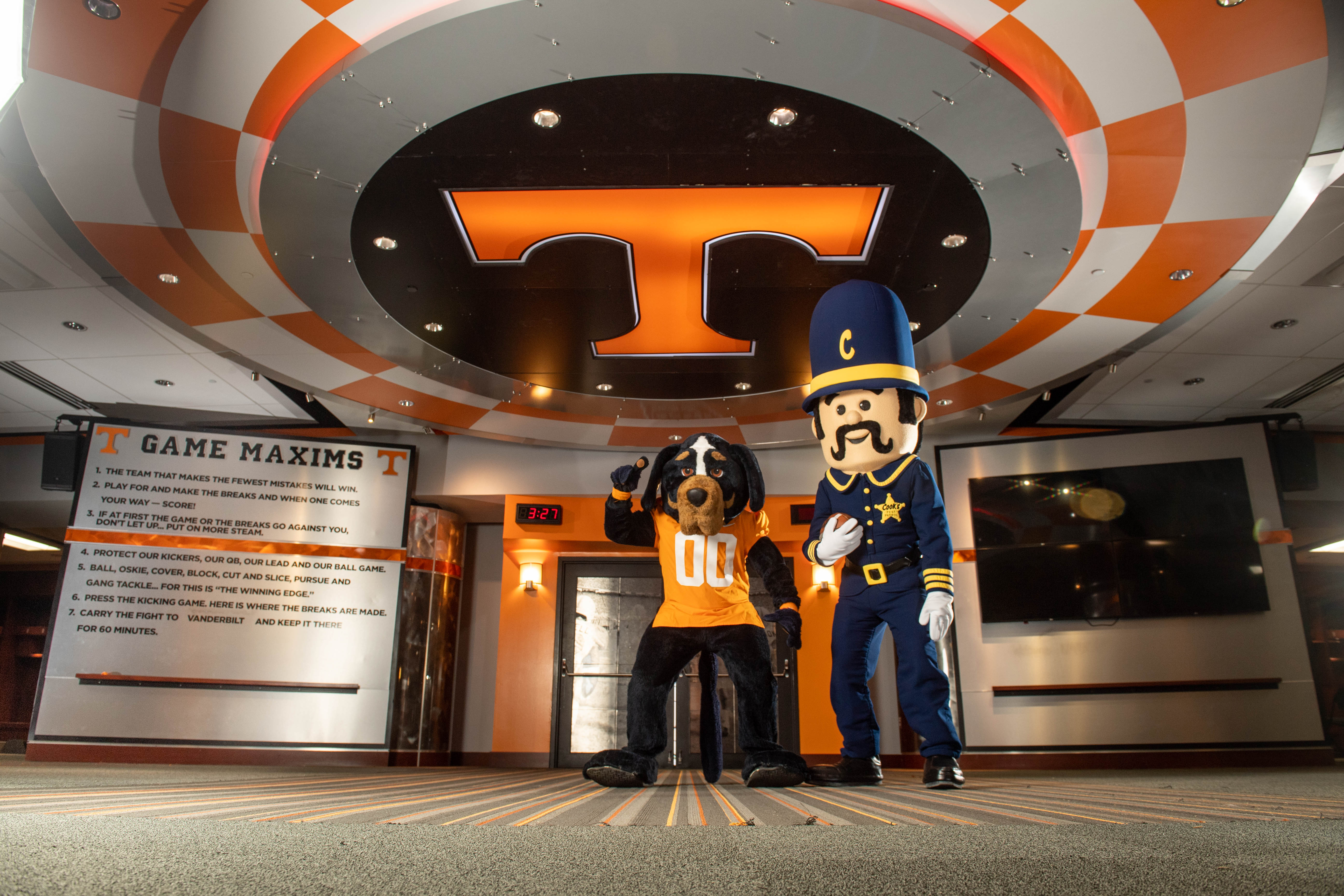 The Tennessee Smokey mascot with the Cook's Pest Patrol mascot inside Neyland Stadium